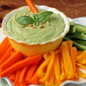 Basil Hummus in a bowl with veggies