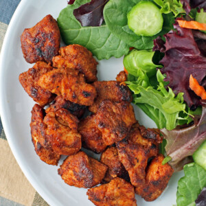 Barbecue Rubbed Chicken Bites plated with salad