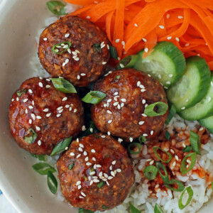 Spicy Korean-Inspired Meatballs with rice, carrots, and cucumbers