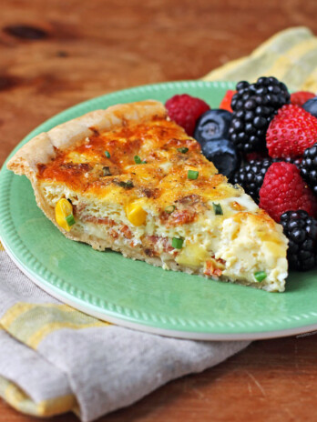 Bacon and Corn Quiche slice on a plate