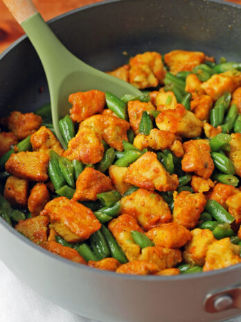 Honey Turmeric Chicken and Green Bean Skillet stirred in pan