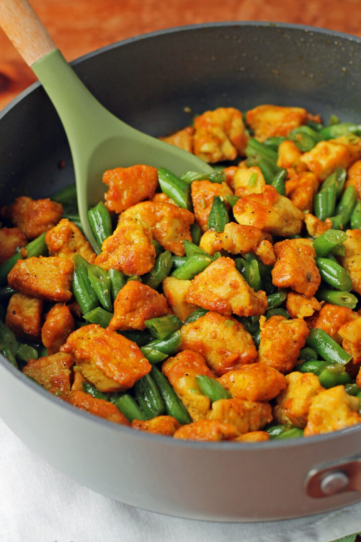 Honey Turmeric Chicken and Green Bean Skillet stirred in pan