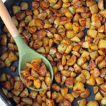 Skillet Breakfast Potatoes in a pan with a spoon