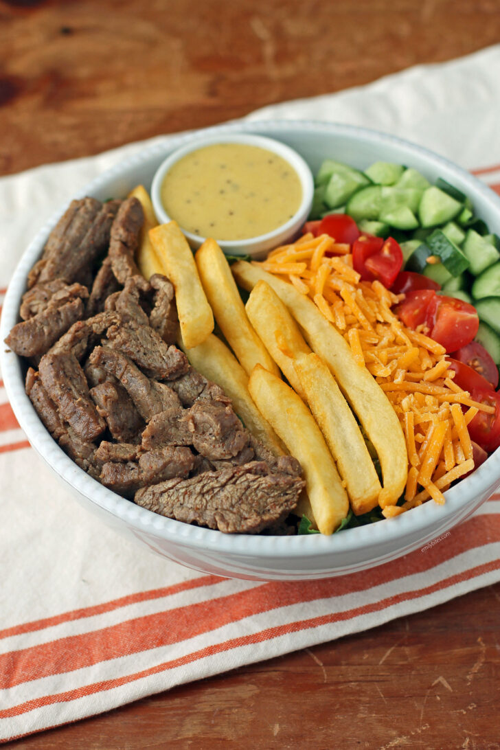 Pittsburgh Steak Salad with Warm Riviera Dressing with ingredients separated