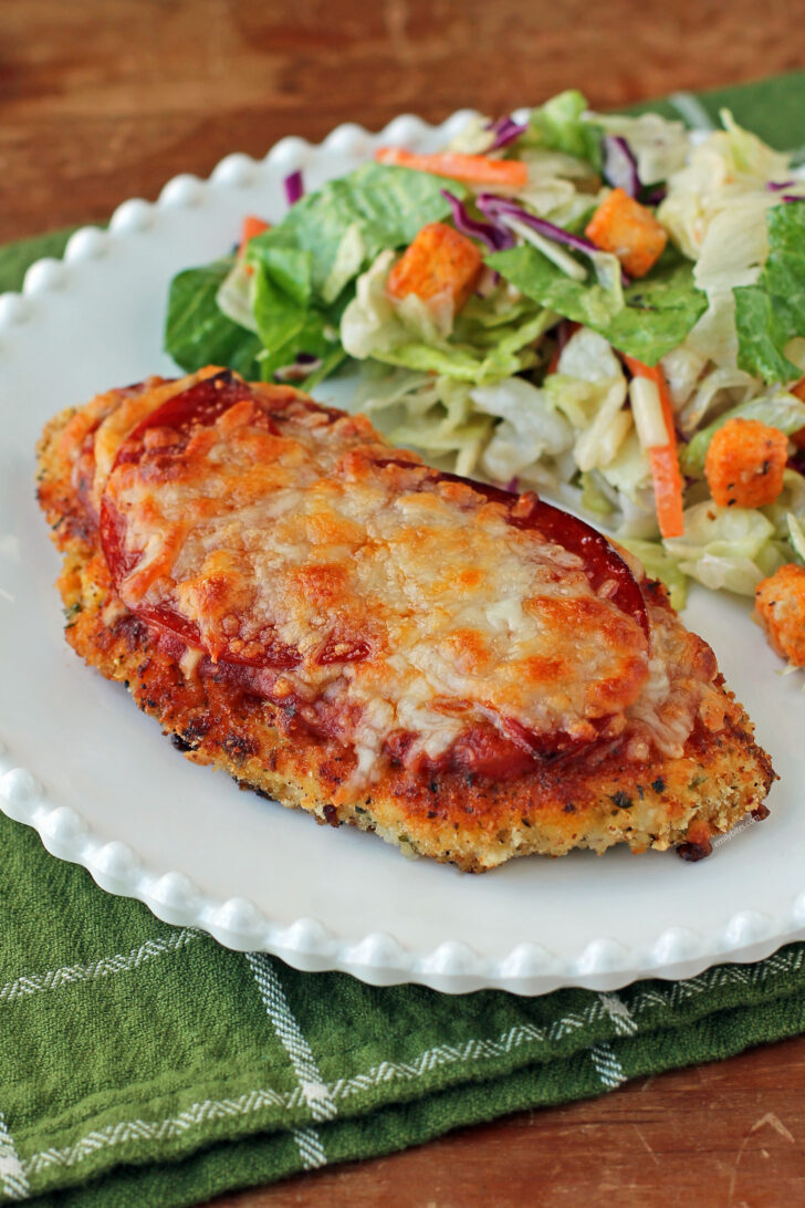 Chicken Pizzesan plated with salad