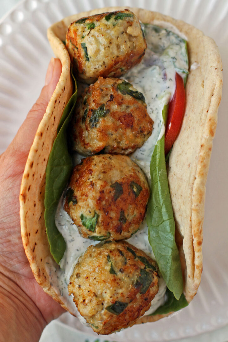 Greek Chicken Meatball Sandwich in hand