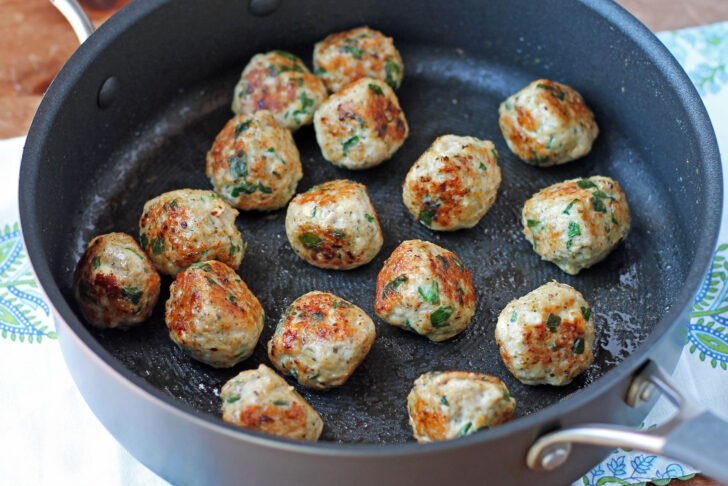 Greek Chicken Meatballs cooked in the pan