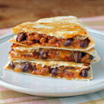 Chorizo Black Bean Quesadilla stacked on a plate