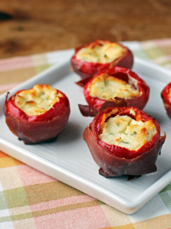 Prosciutto Wrapped Stuffed Cherry Peppers on a plate